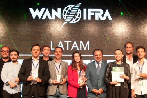 Group of people holding awards