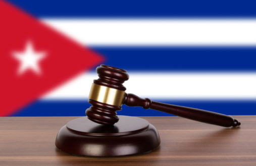 Wooden gavel and flag of Cuba