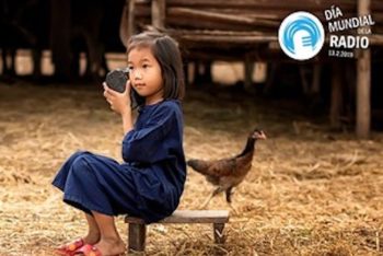 Young girl listening to a radio