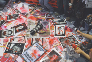 Photos of journalists killed in Mexico with fake blood on them