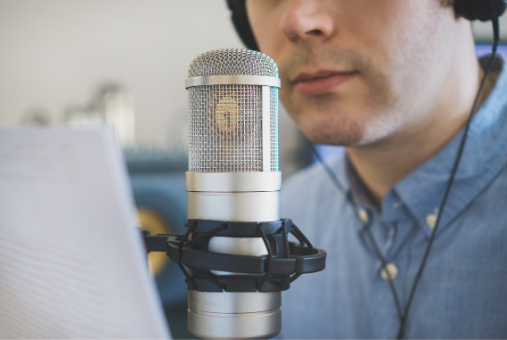 Man wearing headphones at a microphone