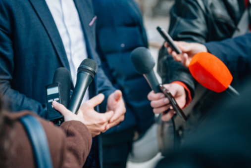 Someone in a suit being interviewed