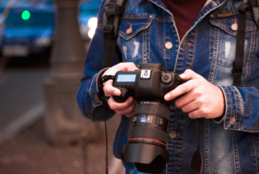 Reporter holding a camera