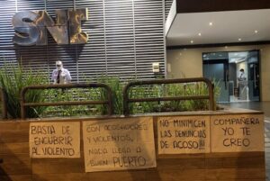 Protest signs in Spanish outside a newsroom in Paraguay.