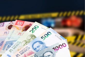 Mexican pesos notes with a blurred background of a crime scene