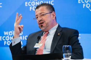 Rodrigo Chaves gives a speech gesturing with his hand at the World Economic Forum in Davos