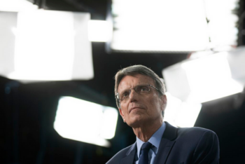 Man in a TV studio looking up