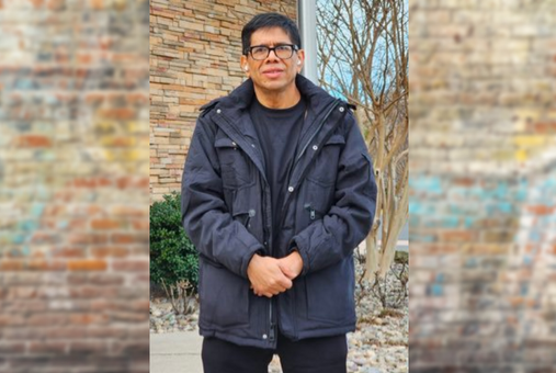 Nicaraguan journalist Miguel Mendoza posing outside a hotel in Washington D.C.