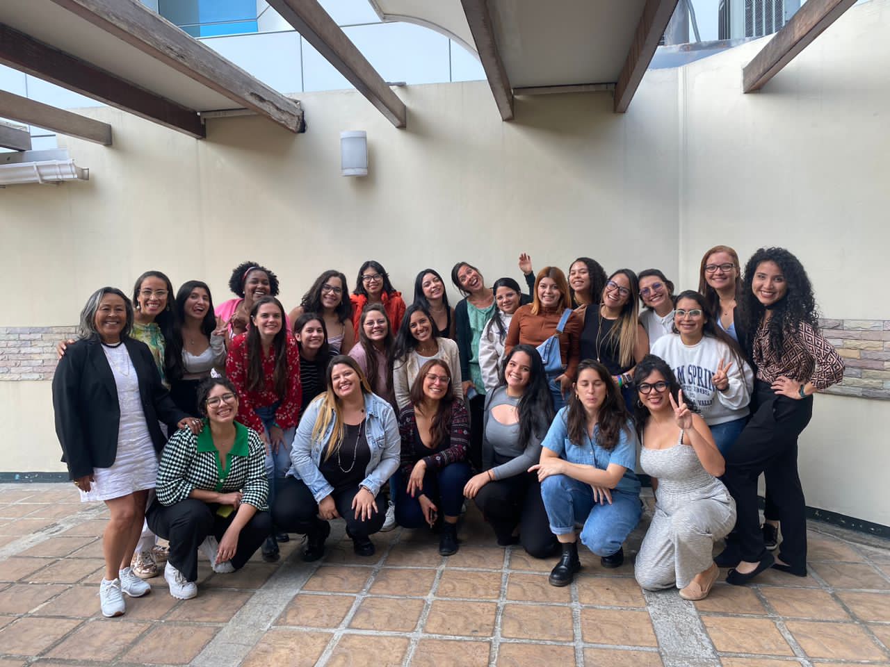 a group of women smiling to the camara