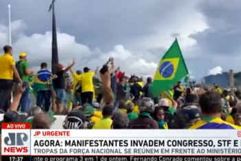Screen shot of Jovem Pan News broadcast during the invasion in Brasilia on January 8, 2023; caption reads "Demonstrators invade Congress, Supreme Court and presidential palace"
