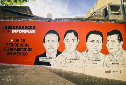 mural painted on a wall shows 4 journalists who disappeared in mexico