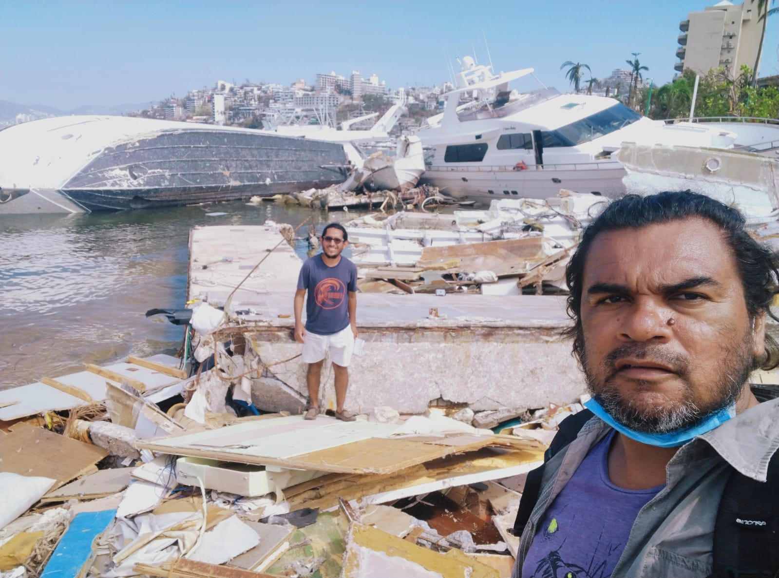 Mexican journalist Carlos Carbajal takes a selfie of him and a colleague during their coverage of the devastation left by Hurricane Otis, in Acapulco, Mexico. 