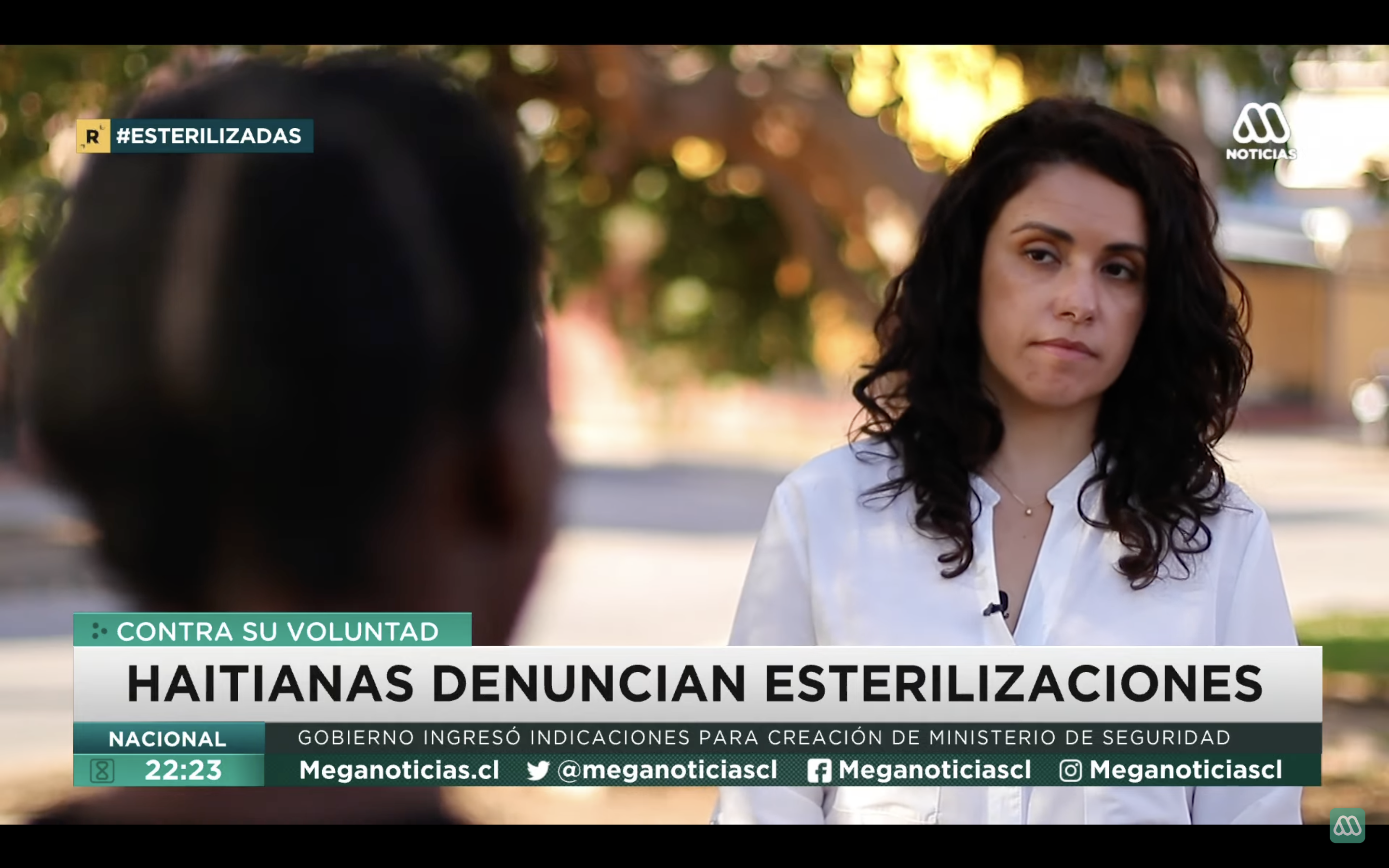 Chilean journalist Rocío Larraguibel interviews a woman for a TV report.