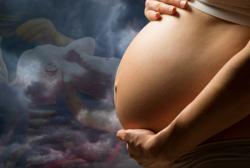 Pregnant woman's belly with a background of dark clouds and the faded image of a baby being born in a surgery room.