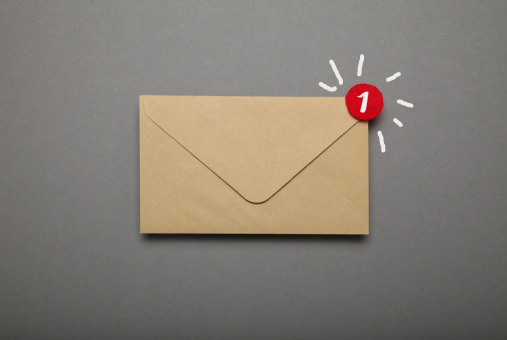 a beige envelope on a gray background