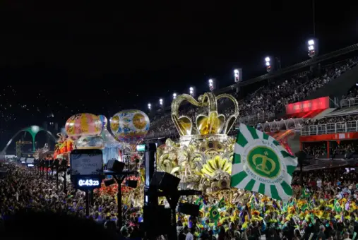 Parade of the Imperatriz Leopoldinense samba school in 2023 including elaborate floats, costumed dancers, and the Apoteose monument at the Sambadrome Marquês de Sapucaí during the Champions Parade