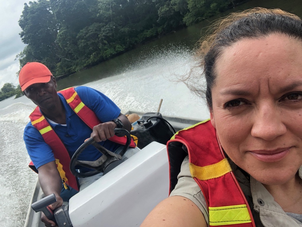 Journalist Dora Montero Carvajal on a boat during a reporting trip in the Colombian Amazon. (Courtesy)