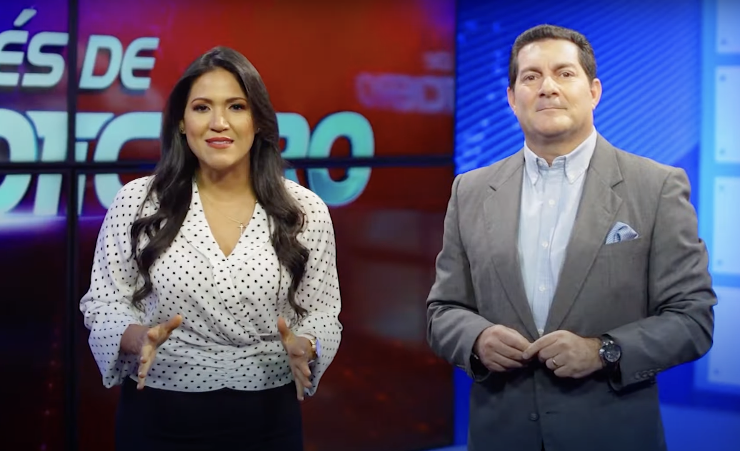 Ecuadorian news anchors Vanessa Filella and Jorge Rendón speak during a newscast of TC Televisión network.