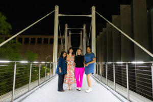 Four women on a bridge