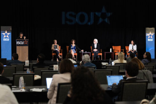 Journalists in front of an audience during ISOJ