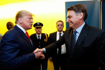 Former Presidents of the United States, Donald Trump, and of Brazil, Jair Bolsonaro, shaking hands at the United Nations headquarters in New York in September 2019. Trump appears energetic and emphatic, while Bolsonaro smiles