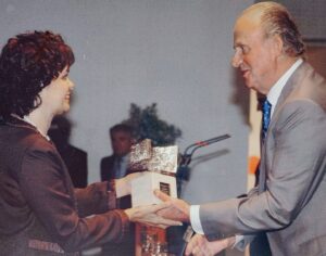 Two people exchanging an award