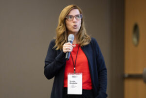 a woman talking to an audience