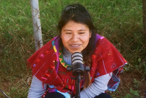 Indigenous woman recording a podcast