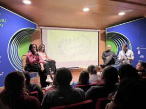 a conference stage with 4 people