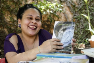 Smiling woman holding book