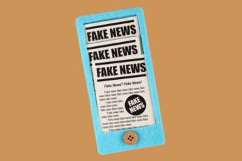 smartphone with fake news newspaper