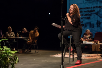 Mexican journalist Marcela Turati speaks on stage during the "