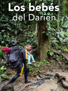 Man crosses jungle with a child in his arms