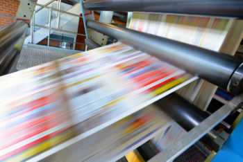 A printing press printing newspapers