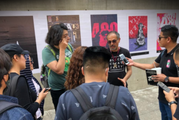 A group of journalism students interview a man in Mexico City.