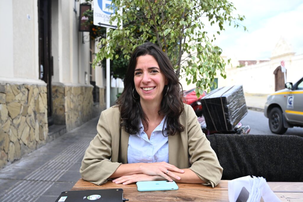 woman sitting and smiling at the camera