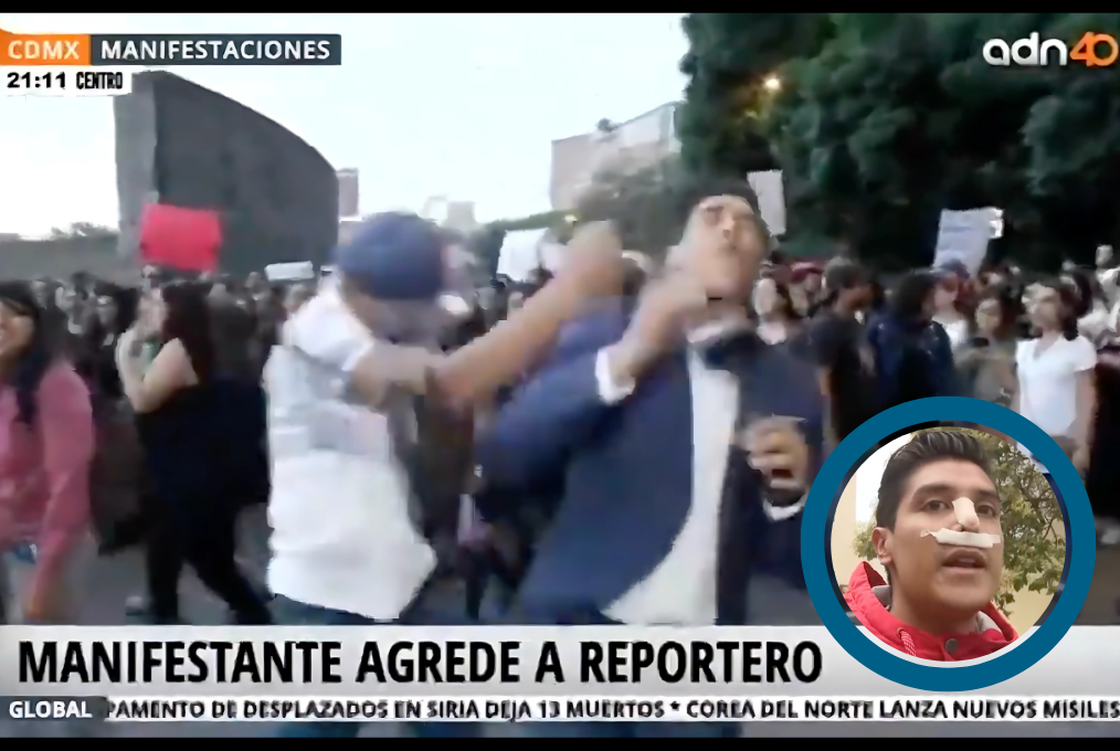 Screenshot of a video of a reporter being hit in the face by a man.