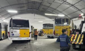 Garage full of buses and investigators