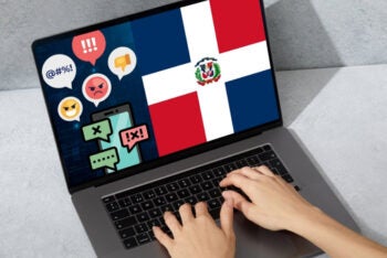 A computer screen displaying the Dominican Republic flag with social media icons