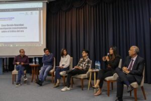 A group of journalists talking on a stage