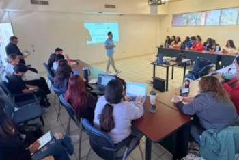 Students attend a class taught by Mexican journalist and professor Abraham Torres.