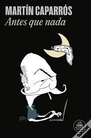 Black cover featuring a stylized illustration of a mustachioed man typing on a laptop beneath a yellow crescent moon; at the top, the text “MARTÍN CAPARRÓS” and “Antes que nada.”
