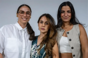 three women posing to the camara