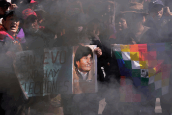 Supporters hold a sign with an image of former President Evo Morales and a message that reads in Spanish; "Without Evo, there are no elections," during a protest demanding he be allowed to compete in the upcoming presidential election, near the Supreme Electoral Tribunal in La Paz, Bolivia, May 29, 2025. (AP Photo/Juan Karita)