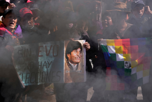 Supporters hold a sign with an image of former President Evo Morales and a message that reads in Spanish; "Without Evo, there are no elections," during a protest demanding he be allowed to compete in the upcoming presidential election, near the Supreme Electoral Tribunal in La Paz, Bolivia, May 29, 2025. (AP Photo/Juan Karita)