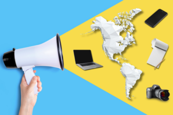 Megaphone with computer, map of the Americas, camera, notebook and cellphone