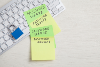 Password message written on sticky notes. Padlock on the keyboard. Password security
