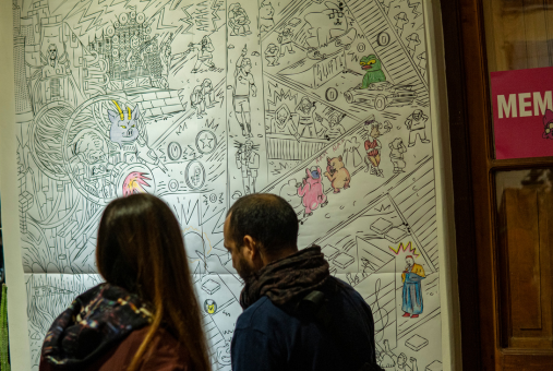 two people looking at a mural