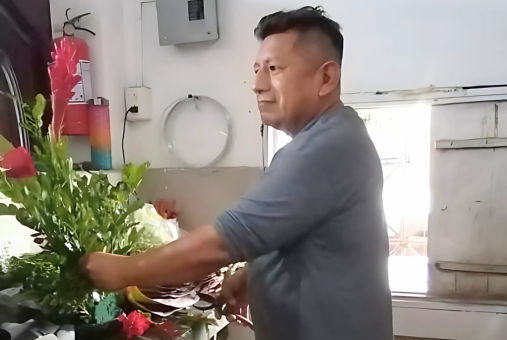 Ecuadorian journalist Johnny Lucas prepares a bouquet of flowers at his brother's flower shop in Manta, Ecuador.