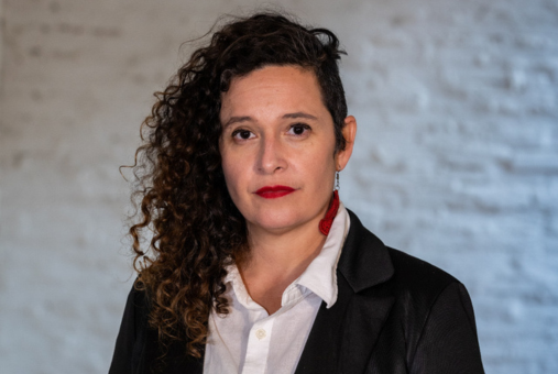 Woman in suit jacket and white blouse